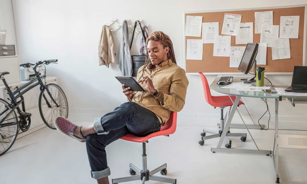 Man working on tablet from home office