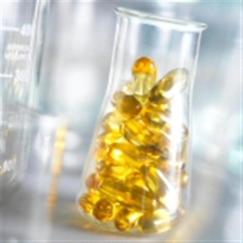 fish oil capsules in a beaker