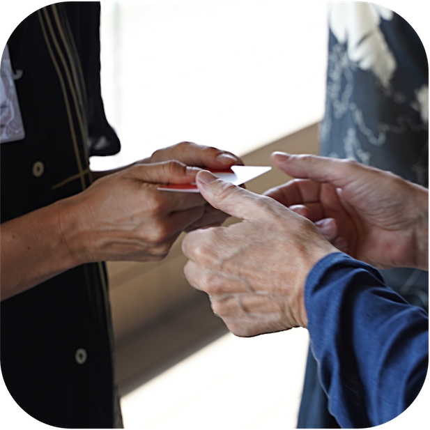 hands exchanging a card - square thumbnail