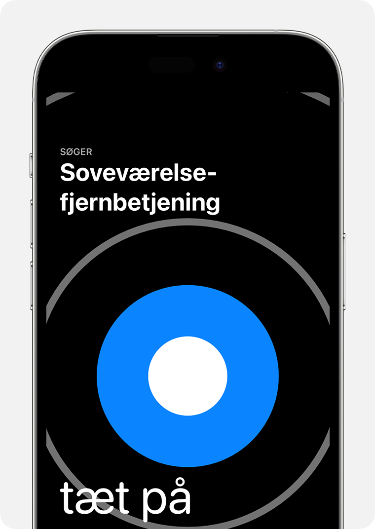 En stor blå cirkel vises på en iPhone-skærm med ordene 