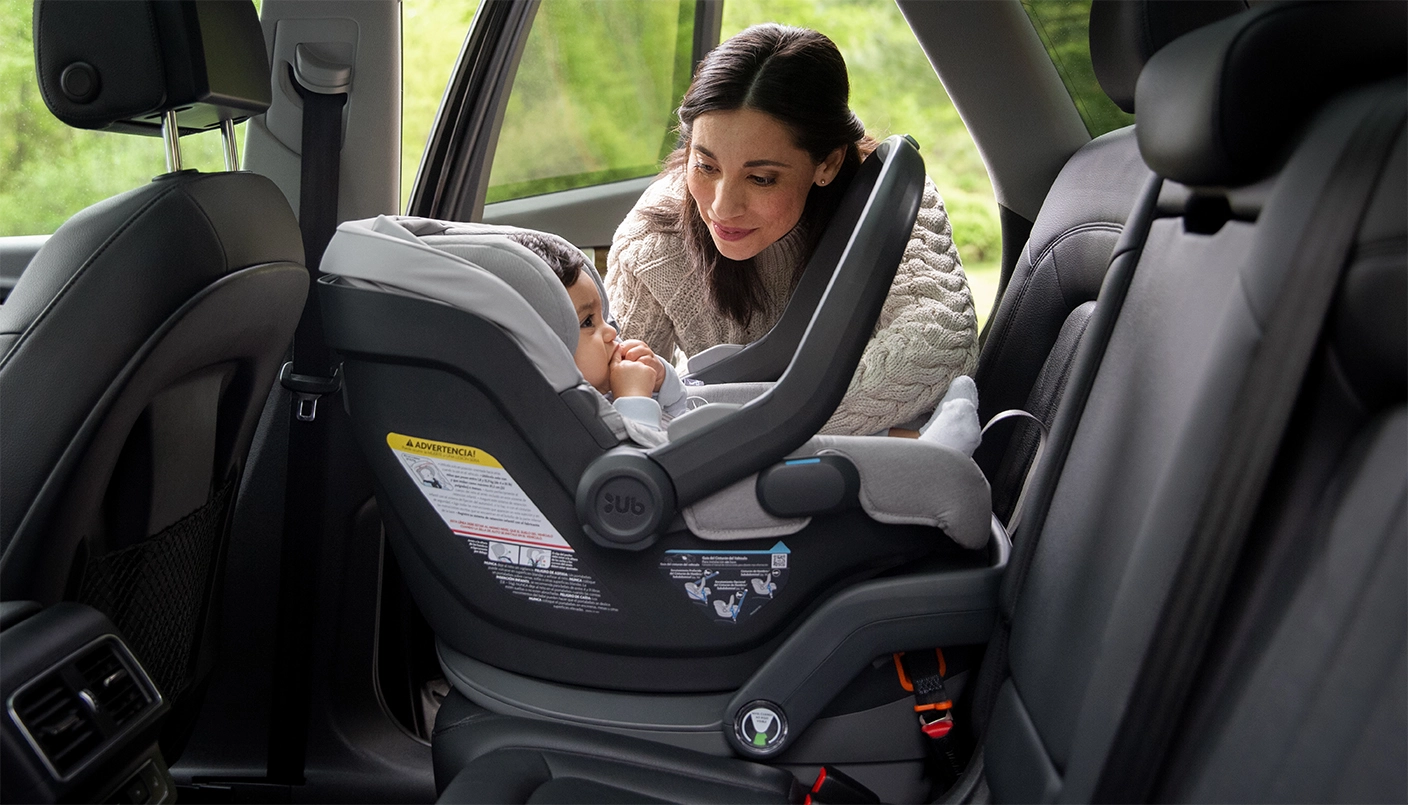 Child in car seat attached to Car Seat Base for Mesa and Mesa V2