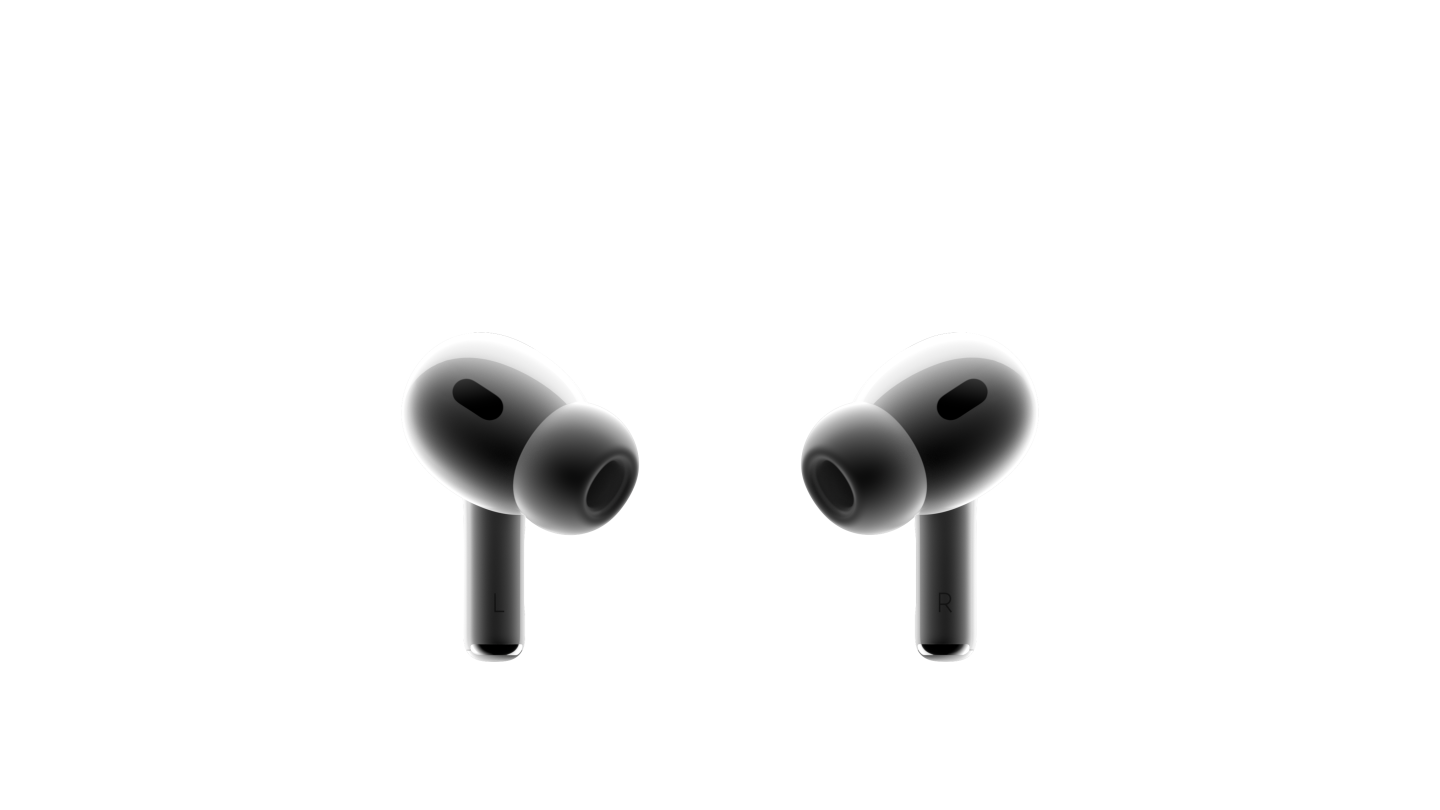 Hai chiếc tai nghe AirPods Pro màu trắng hướng mặt vào nhau. Mỗi một chiếc tai nghe nhỏ gọn có gắn đầu tai nghe bằng silicon và có một ô lưới màu đen.