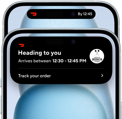 iPhone 15 showing Dynamic Island expanded view of Doordash delivery status