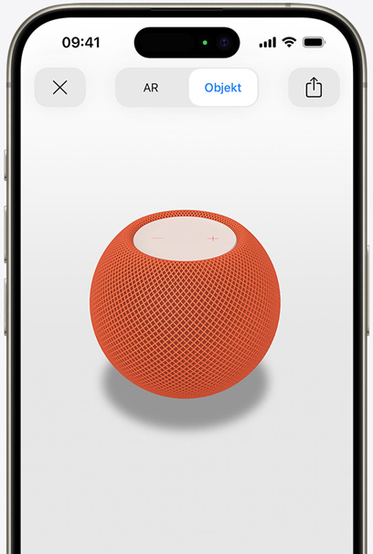 Der HomePod in Orange auf dem Display eines iPhone in AR Ansicht.