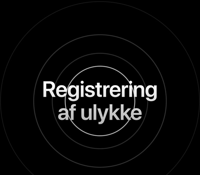 Ordene “Registrering af ulykke” omgivet af ringe, hvis tydelighed langsomt fader ud.