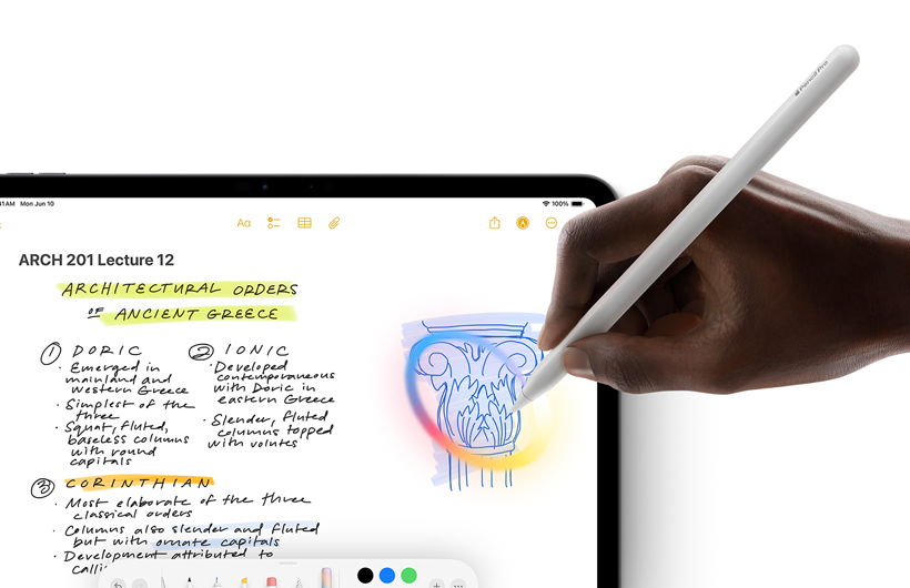 A hand holding Apple Pencil draws a circle round a sketch in the Notes app on iPad.