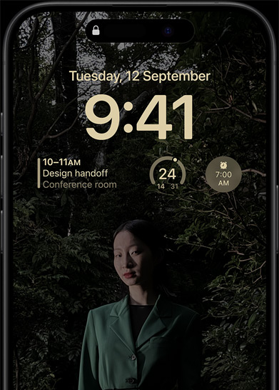 The Always-On display of iPhone 15 Pro showcasing a Lock Screen with a calendar widget, a weather widget, and an alarm widget