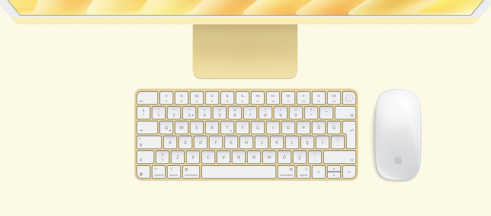 Sarı iMac ile aynı renkteki mouse ve klavyenin tepeden görünümü