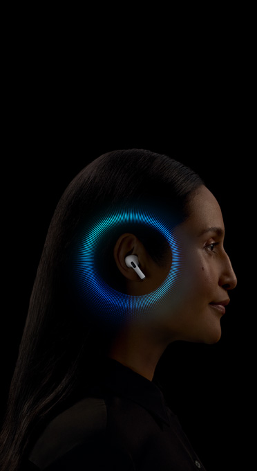 The right side of a woman’s head. AirPods Pro is in her ear. A circular graphic eminates from AirPods Pro.