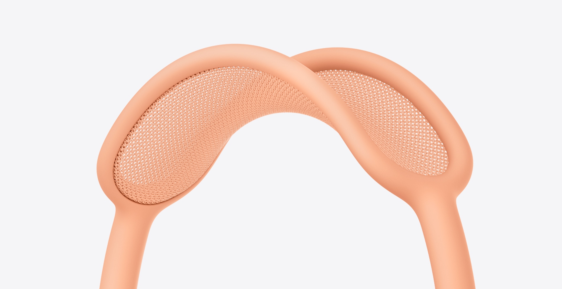 Close‑up van de hoofdband van AirPods Max in de kleur oranje.