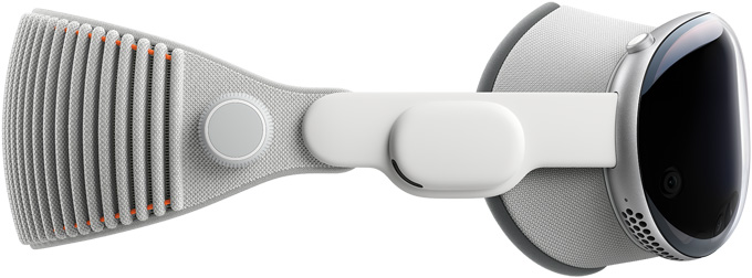 Vue de profil d’un Apple Vision Pro auquel sont attachés un cache occultant et un bandeau tissé réglable.