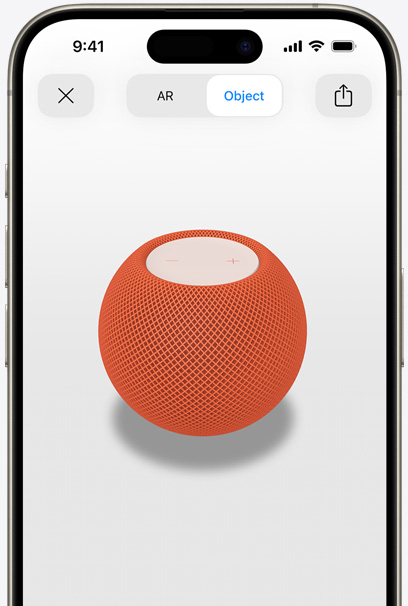 Orange HomePod on the screen of an iPhone in AR view.