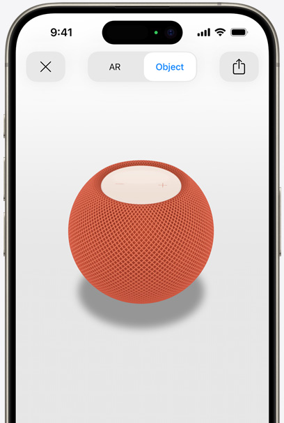 En HomePod i farven orange vises i AR på en iPhone-skærm.
