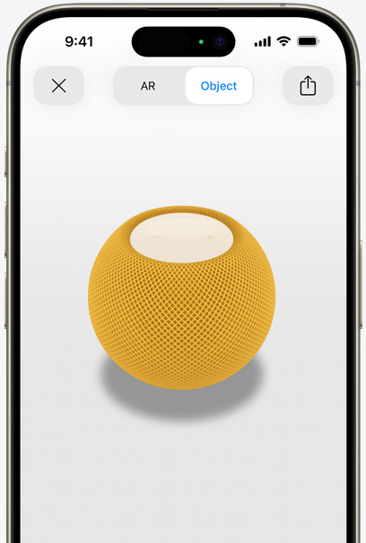 En HomePod i farven gul vises i AR på en iPhone-skærm.