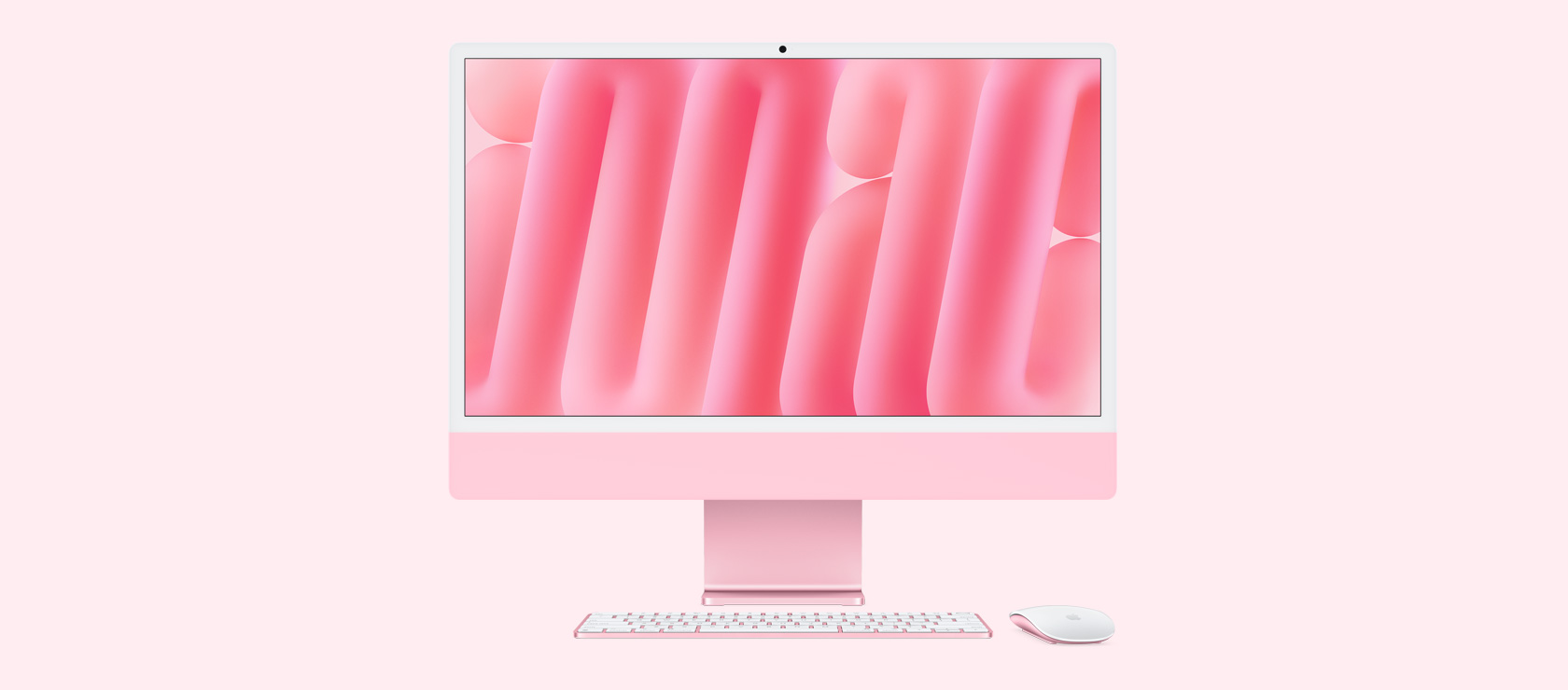 Front view of pink iMac with color-matching mouse and keyboard