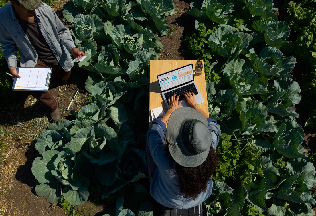 A photo of a person on a photoshoot editing their photos on their MacBook Pro.