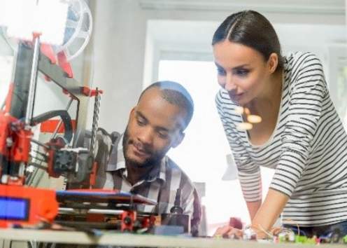 man and woman working on protoype