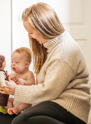 A mother plays with her child. 