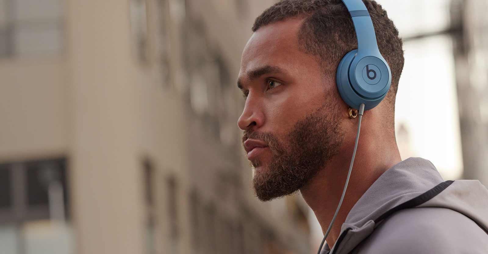 Man wearing Solo 4 headphones