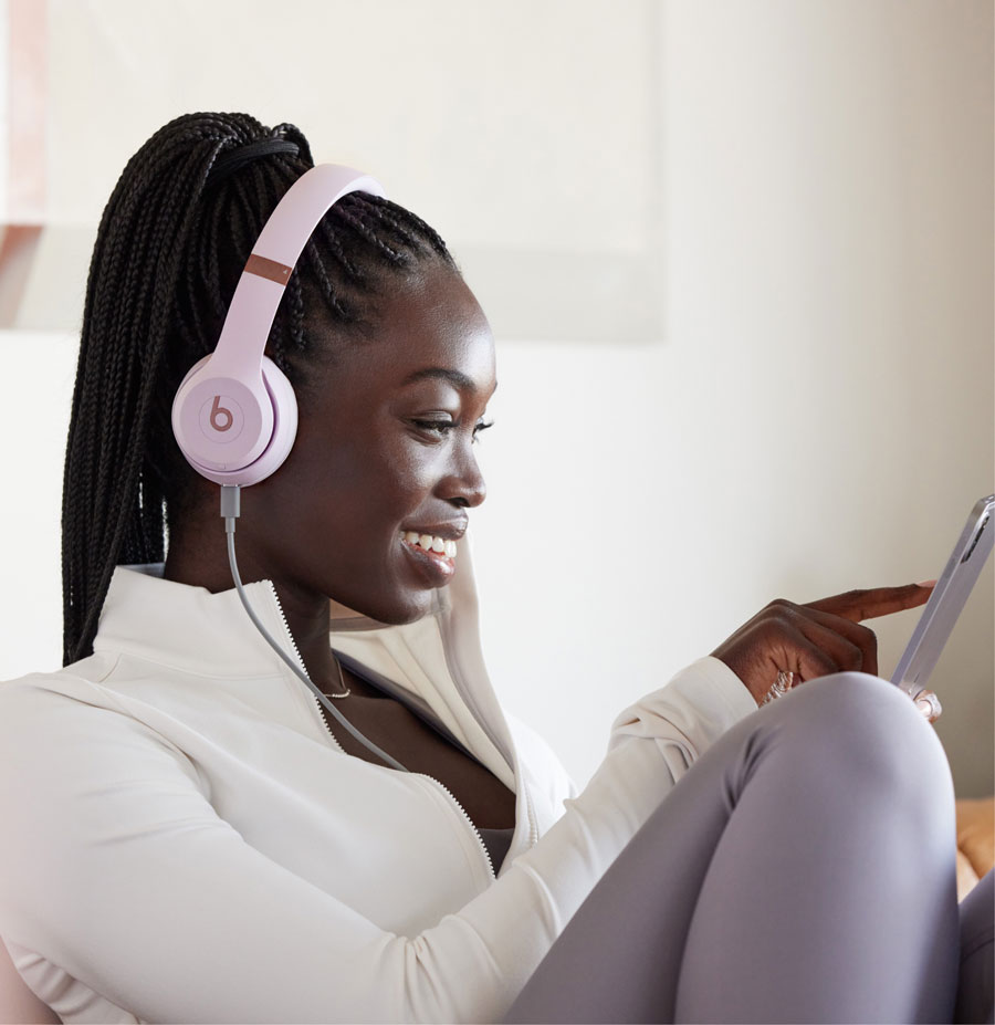 Person enjoying 6 months of free Apple Music