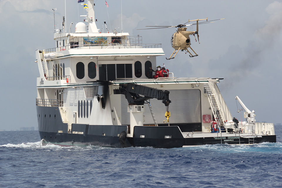 Unmanned Little Bird H-6U approaching boat