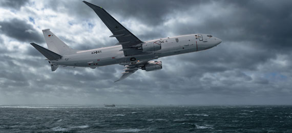 P-8 in flight in cloudy skies.