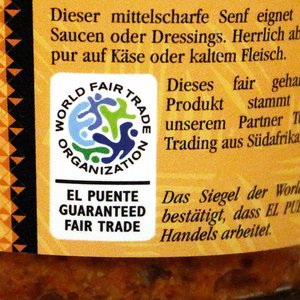 WFTO-Label "Garanteed Fair Trade Organization" auf einem Senfglas