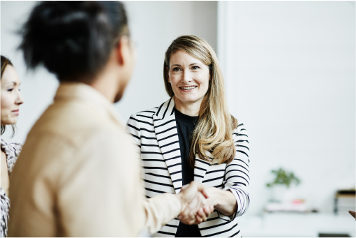 Office workers exchanging greetings