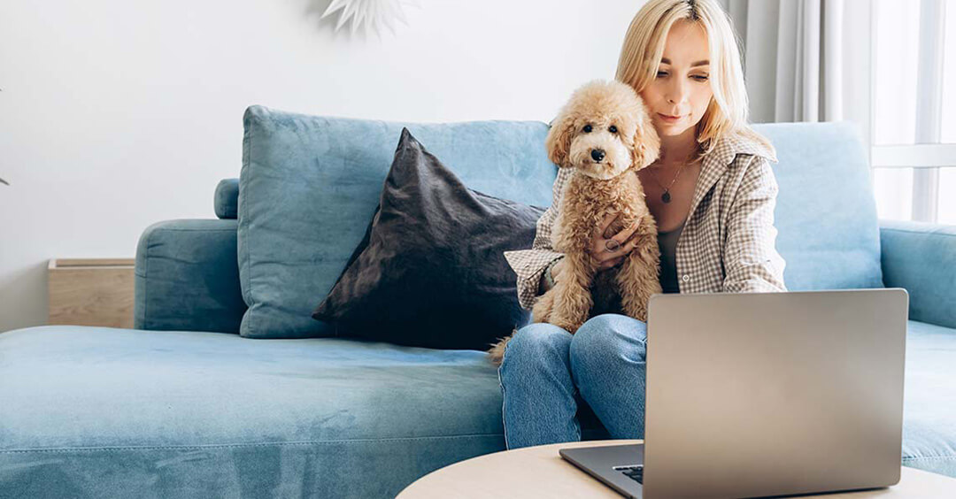 Women working at home with dog