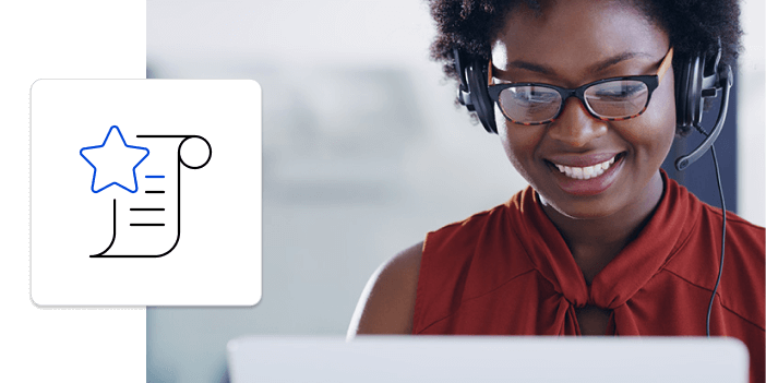 Woman with glasses and headphones looking at a laptop