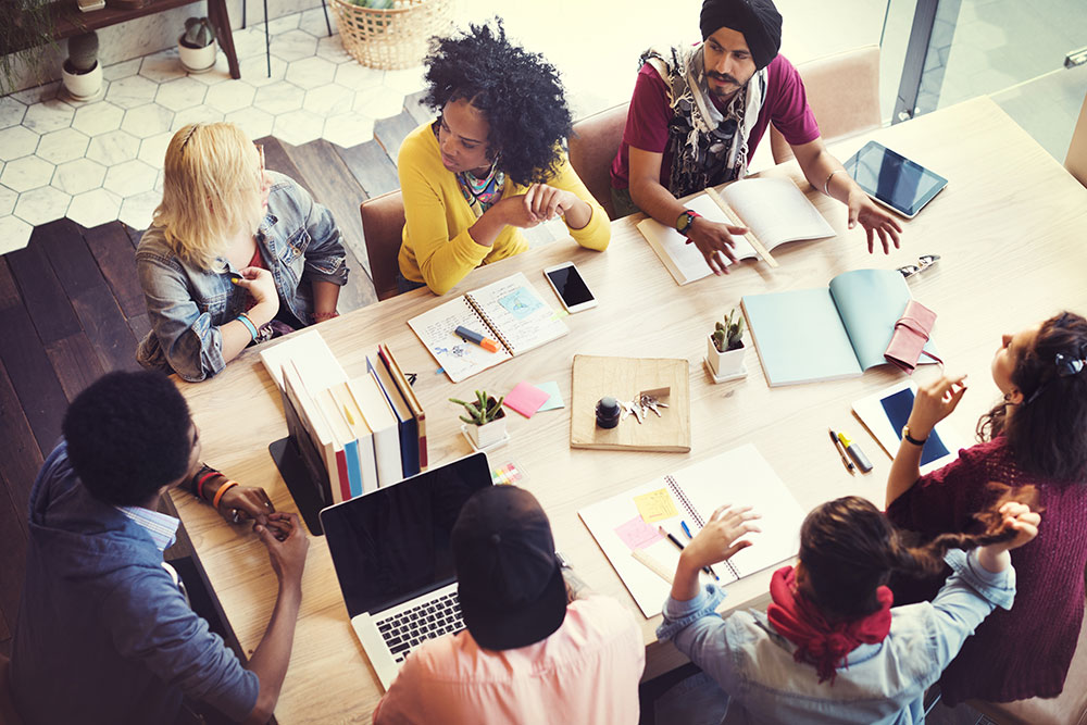 Image of coworkers at a meeting