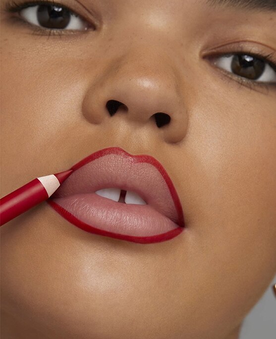 photo of woman lining lips with lip liner lip contouring technique