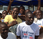 Dr. Soka Moses smiling with other volunteers.