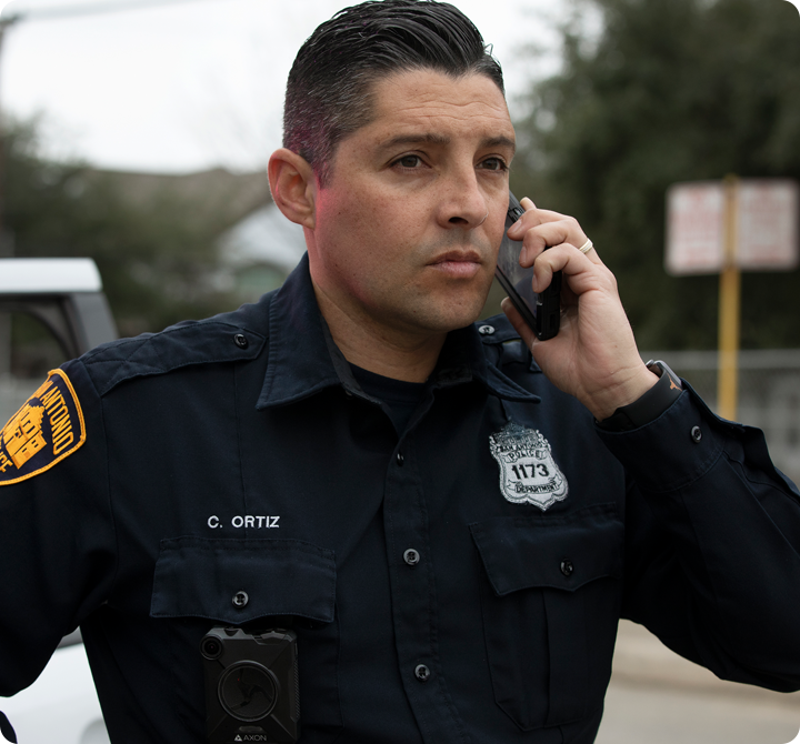 Police officer using smart phone