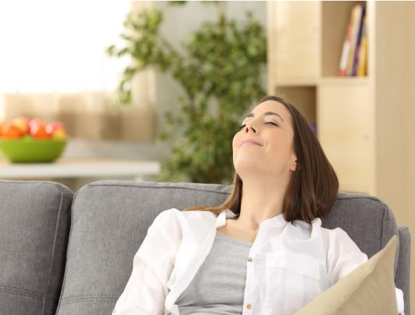 woman sitting on couch