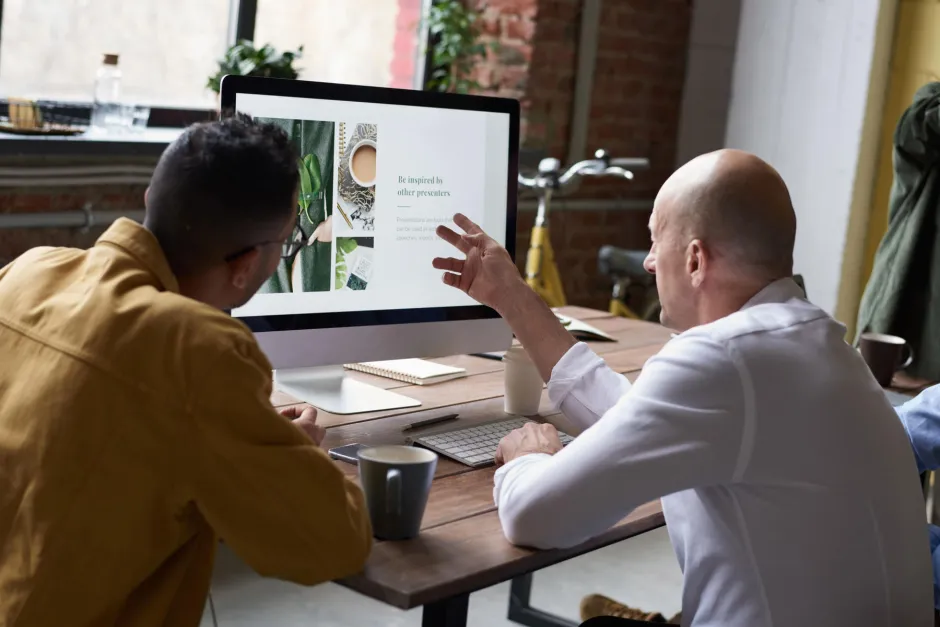 Men using imac indoors 3182780