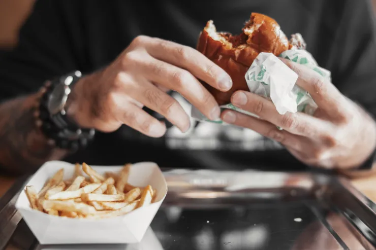 Eating burger in store