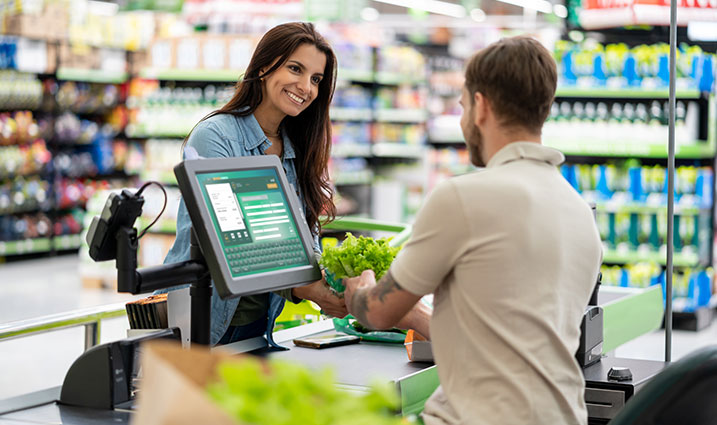 Customer checking out in a grocery store