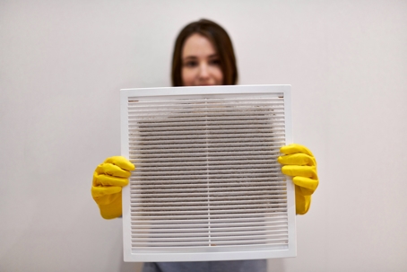 woman holding air vent