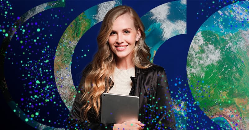 Smiling user with long blonde hair holds a laptop against a dark background with globe slices