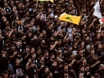 People hold pictures of Lebanon's Hezbollah Chief Hassan Nasrallah who was killed by an Israeli airstrike in Beirut, during a symbolic funeral in Baghdad, Iraq, September 29, 2024. REUTERS/Thaier al-Sudani(REUTERS)