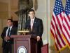 House Speaker Paul Ryan standing behind a podium next to the U.S. flag