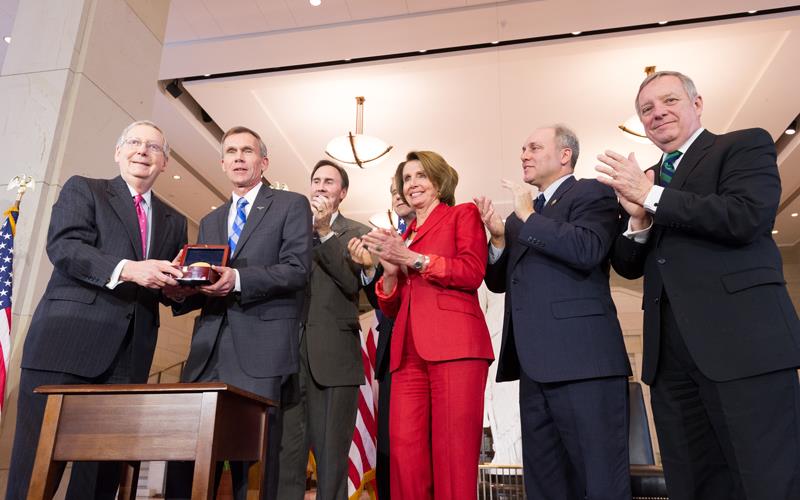 Lt. Gen. John Hudson accepts medal from Congressional leaders