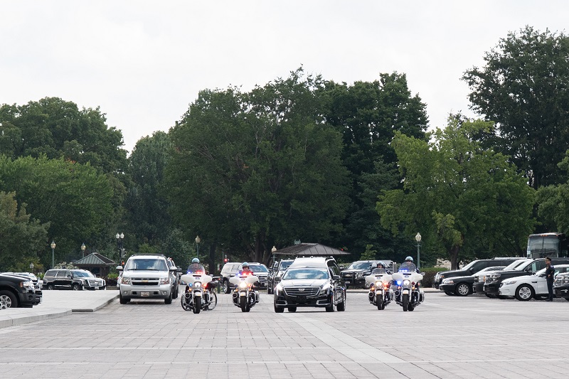 A hearse carrying the Senator McCain arrives at the U.S. Capitol. Photo by Phi Nguyen.