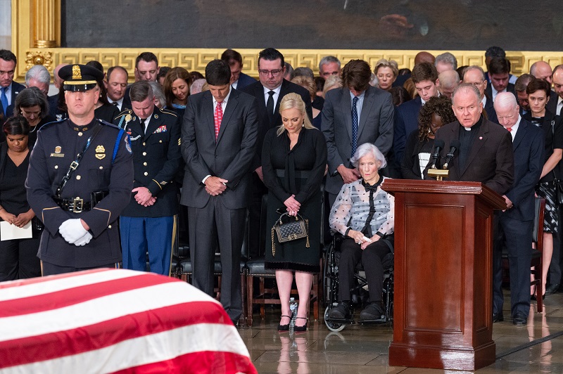 U.S. House Chaplain, Reverend Patrick Conroy says an opening prayer at the ceremony to honor Senator