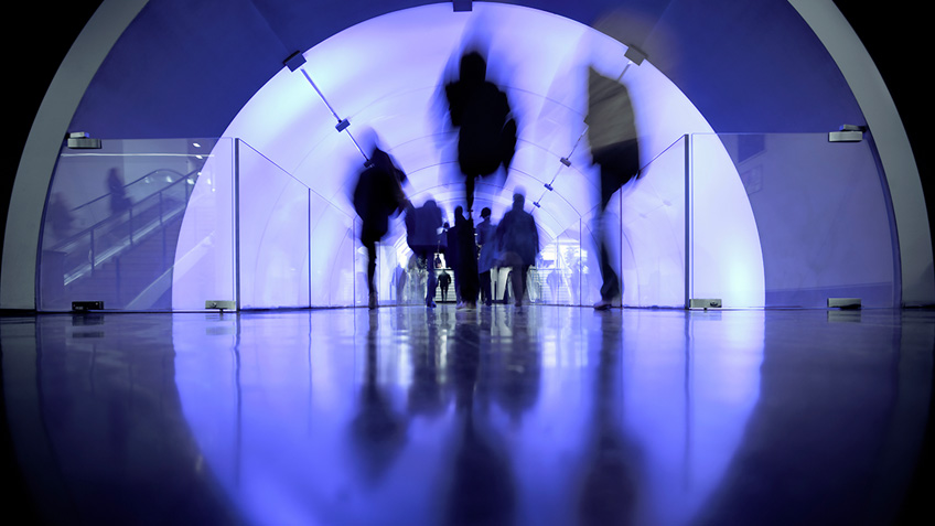 Distorted view of people in a tunnel