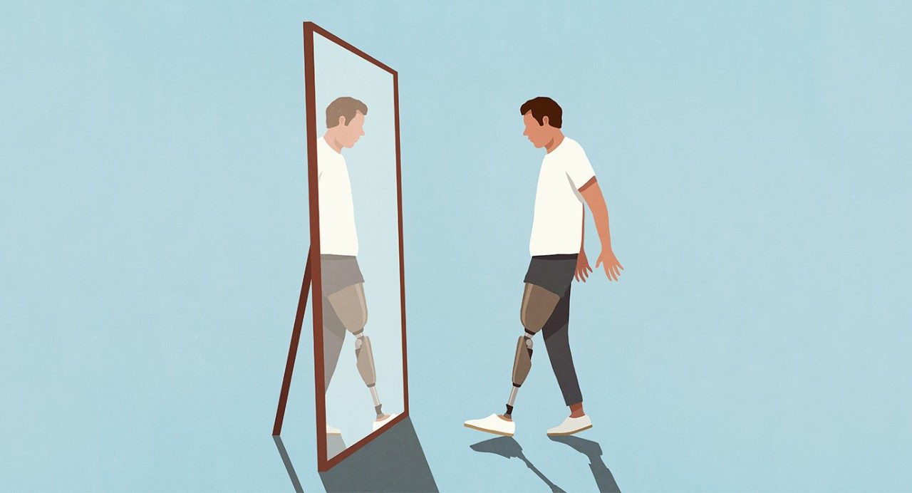 Man with a prosthetic leg looking in the mirror.