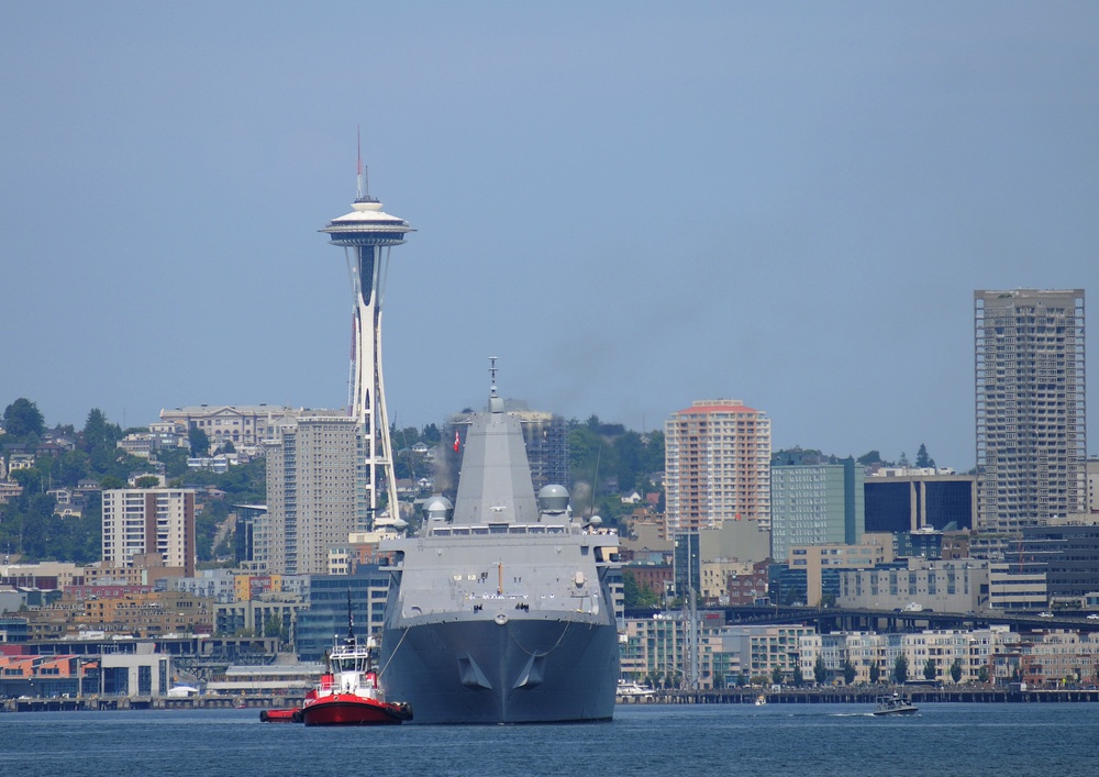 The amphibious transport dock ship USS Green Bay maneuvers through Elliot Bay to the Port of Seattle to participate in the 61st annual Seattle Seafair Fleet Week. Seafair activities allow U.S. and Canadian sailors to experience the local community and to promote awareness of the maritime forces.