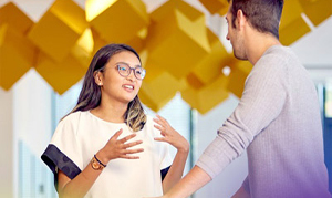 Man and woman in conversation in a modern office