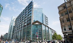 Exterior photo of banking headquarters from street, daytime.